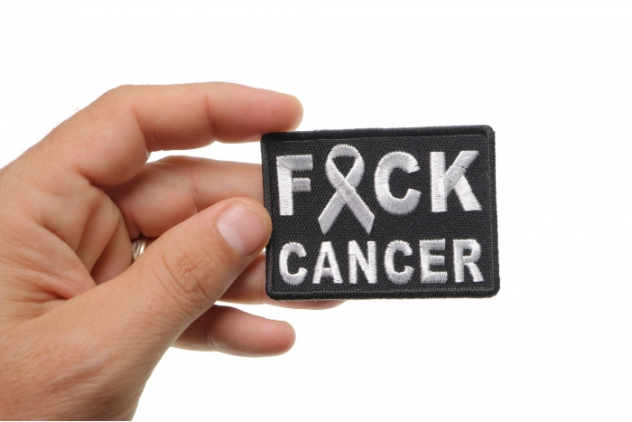 FCK Cancer White Ribbon Patch shown on hand for size comparison