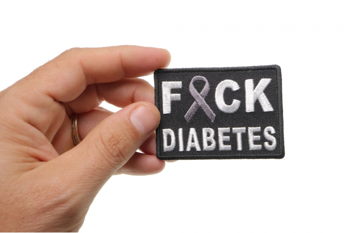 FCK Diabetes Gray Ribbon Patch shown on hand for size comparison