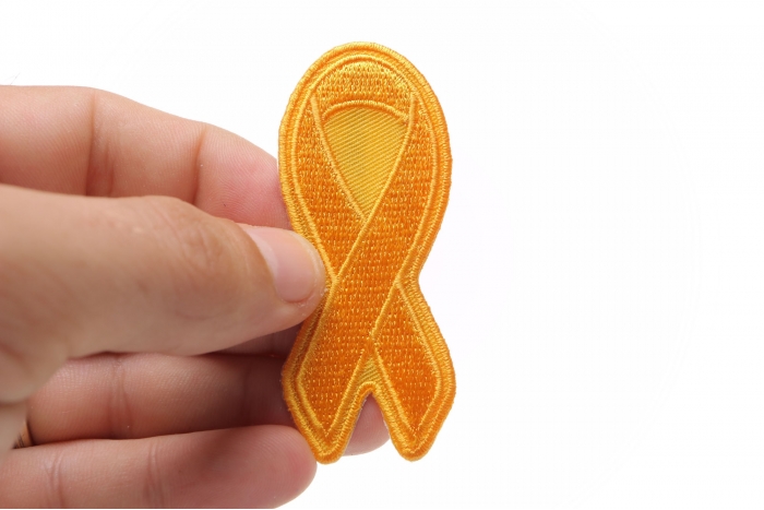 Orange Leukemia Awareness Ribbon Patch shown on hand for size comparison