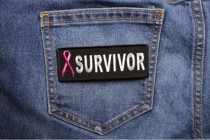 Breast Cancer Survivor Pink Ribbon Patch shown on jeans