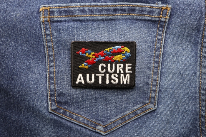 Cure Autism Puzzle Pieces Ribbon Patch shown on jeans