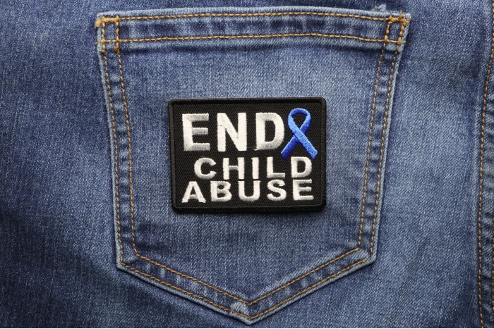 End Child Abuse Blue Ribbon Patch shown on jeans