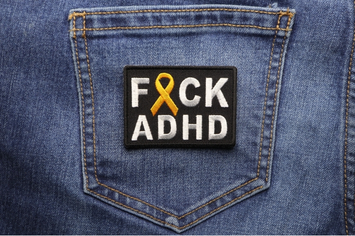 FCK ADHD Orange Ribbon Patch shown on jeans