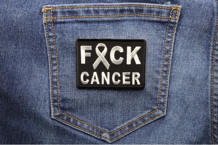 FCK Cancer White Ribbon Patch shown on jeans