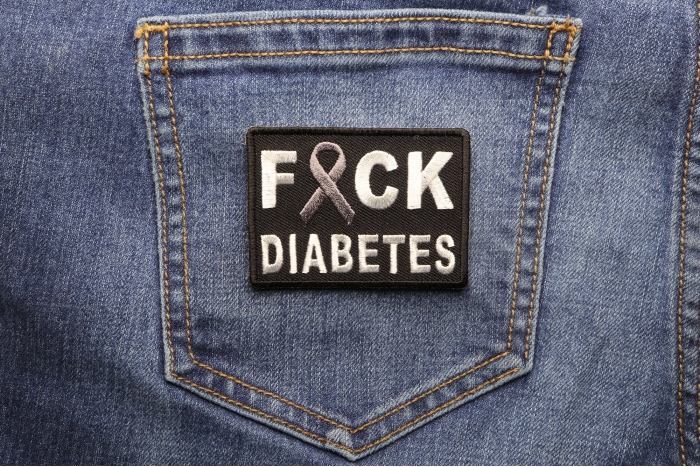 FCK Diabetes Gray Ribbon Patch shown on jeans