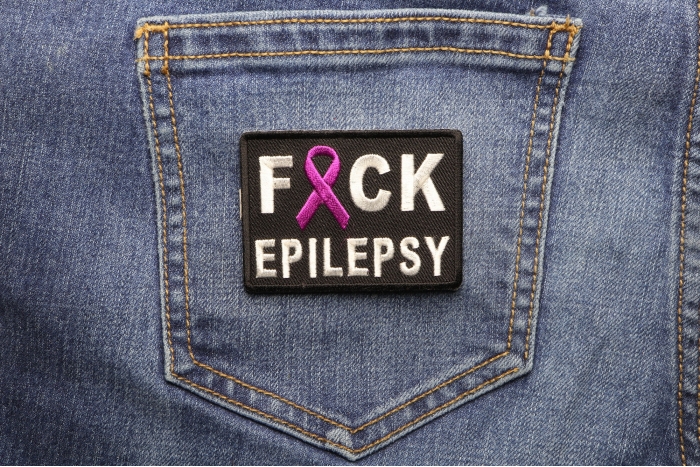 FCK Epilepsy Patch shown on jeans