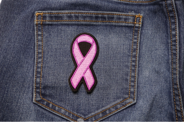 Purple Ribbon Patch For Breast Cancer Survivors shown on jeans