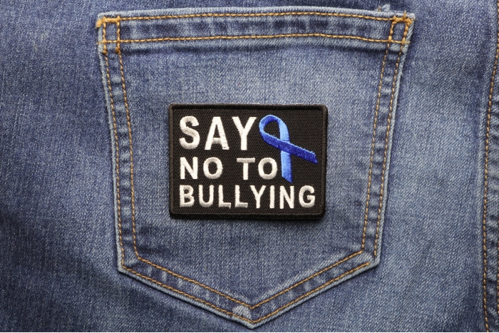 Say No To Bullying Blue Ribbon Patch shown on jeans