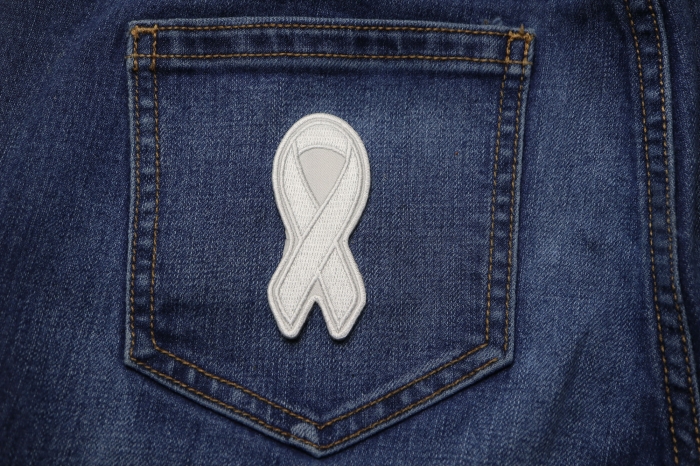 White Lung Cancer Awareness Ribbon Patch shown on jeans
