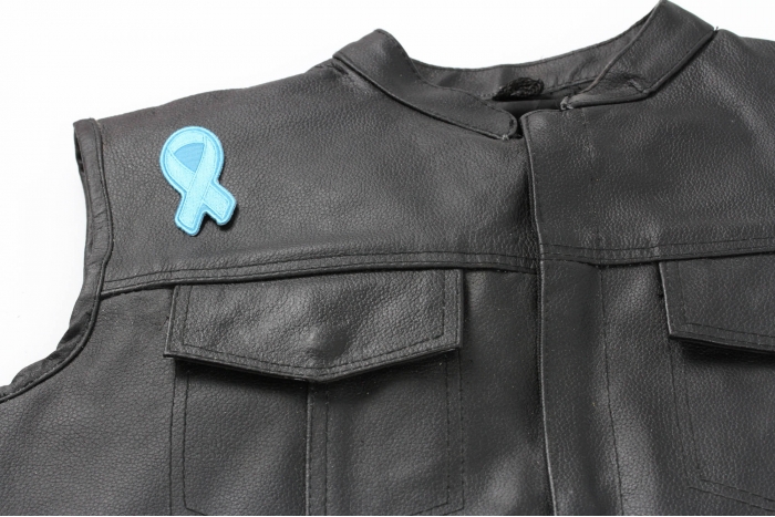 Blue Ribbon Patch For Awareness In Child Abuse and Bullying - 3x1.25 inch. Embroidered Iron on Patch shown on leather vest