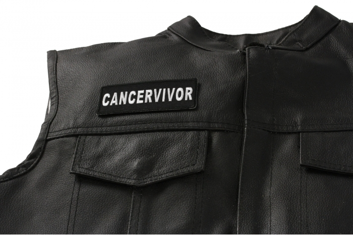 Cancervivor Patch - 4x1.5 inch. Embroidered Iron on Patch shown on leather vest