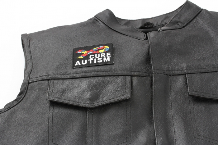 Cure Autism Puzzle Pieces Ribbon Patch - 2.75x2 inch. Embroidered Iron on Patch shown on leather vest