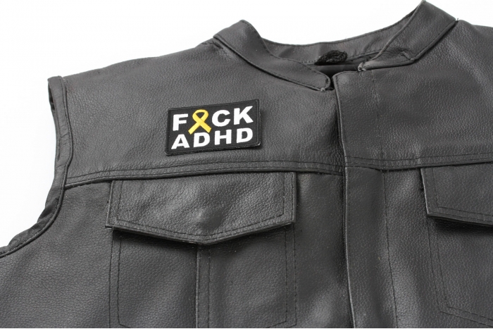FCK ADHD Orange Ribbon Patch - Iron on Patch - 2.75x2 inch shown on leather vest
