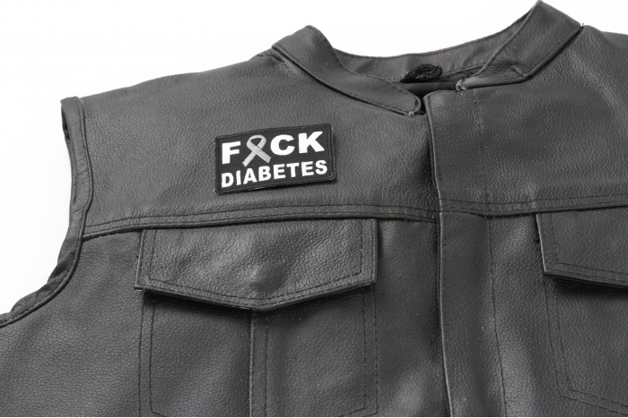 FCK Diabetes Gray Ribbon Patch - 2.75x2 inch. Embroidered Iron on Patch shown on leather vest