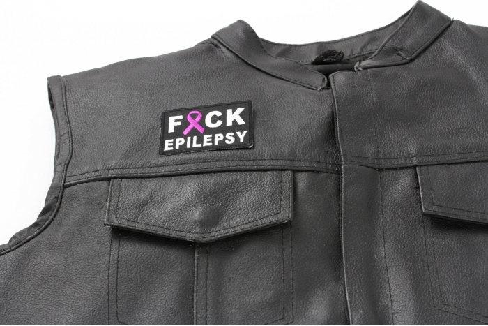 FCK Epilepsy Patch - 2.75x2 inch. Embroidered Iron on Patch shown on leather vest