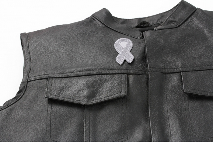 Gray Asthma Awareness Ribbon Patch - 3x1.25 inch. Embroidered Iron on Patch shown on leather vest