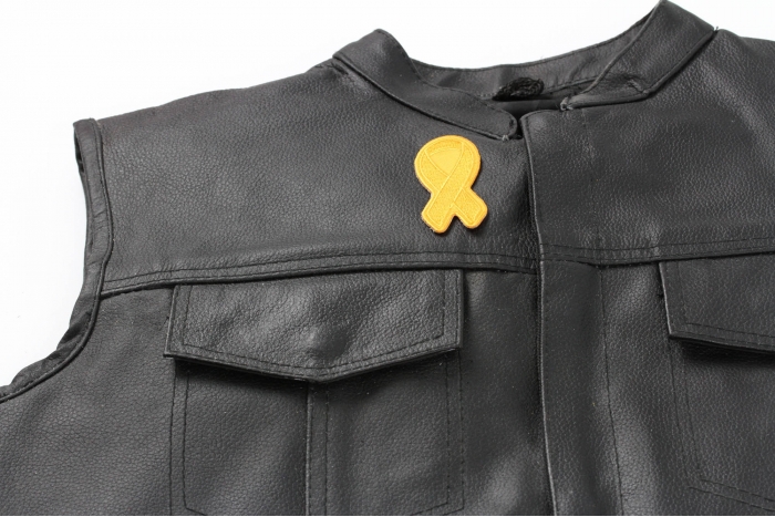 Orange Leukemia Awareness Ribbon Patch - 3x1.25 inch. Embroidered Iron on Patch shown on leather vest