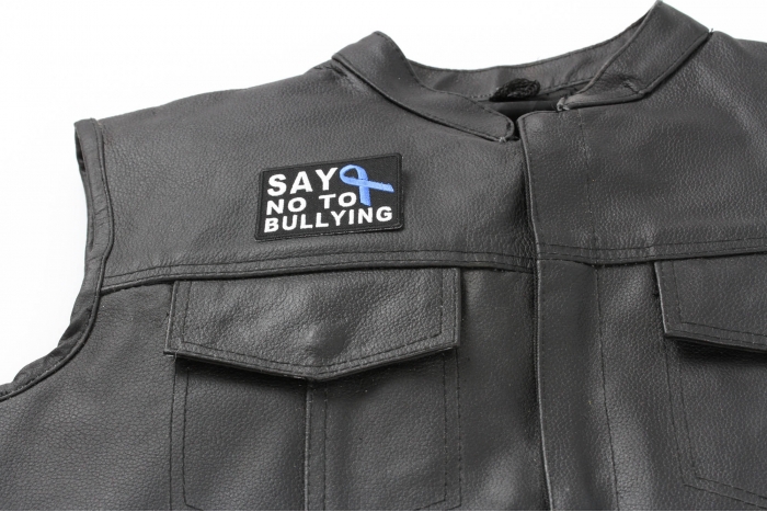Say No To Bullying Blue Ribbon Patch - 2.75x2 inch. Embroidered Iron on Patch shown on leather vest