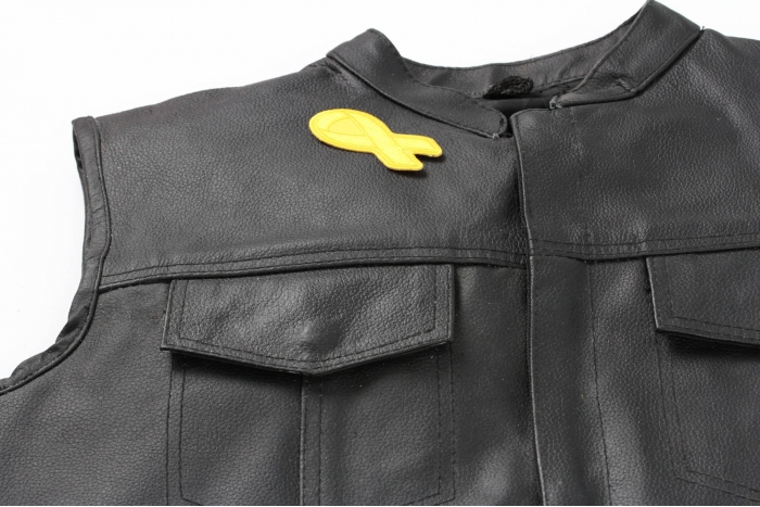 Yellow Ribbon Patch - 3x1.25 inch. Embroidered Iron on Patch shown on leather vest