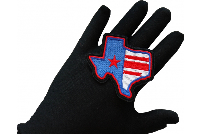 Texas Pride Iron on Patch shown on hand for size comparison