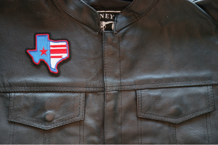 Texas Pride Iron on Patch shown on leather vest