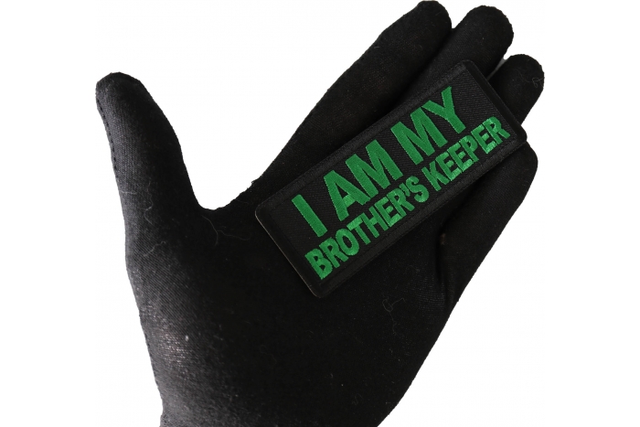I am My Brother's Keeper Patch green shown on hand for size comparison