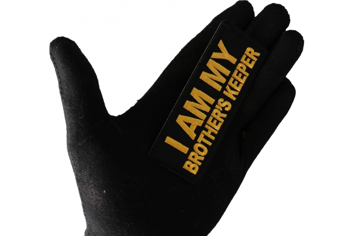 I am My Brother's Keeper Patch Yellow shown on hand for size comparison