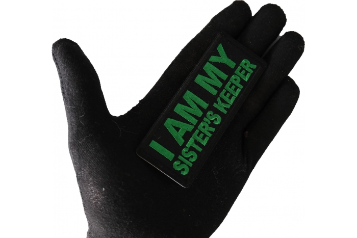 I am My Sister's Keep Patch Green shown on hand for size comparison