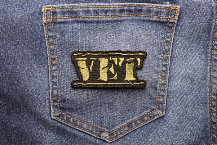 Vet Patch Old Stamper Green shown on jeans