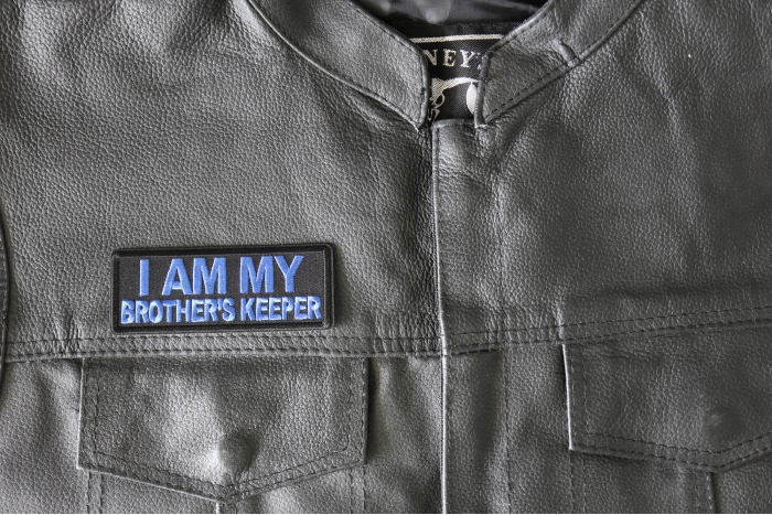 I am My Brother's Keep Patch Blue - 4x1.5 inch - Embroidered Iron on Patch shown on leather vest