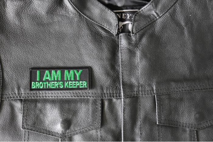 I am My Brother's Keep Patch green - 4x1.5 inch - Embroidered Iron on Patch shown on leather vest