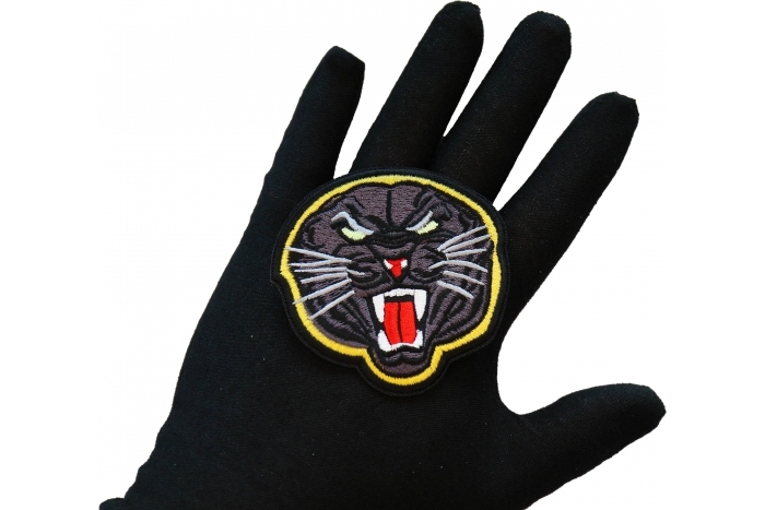 Black Jaguar Iron on Patch shown on hand for size comparison