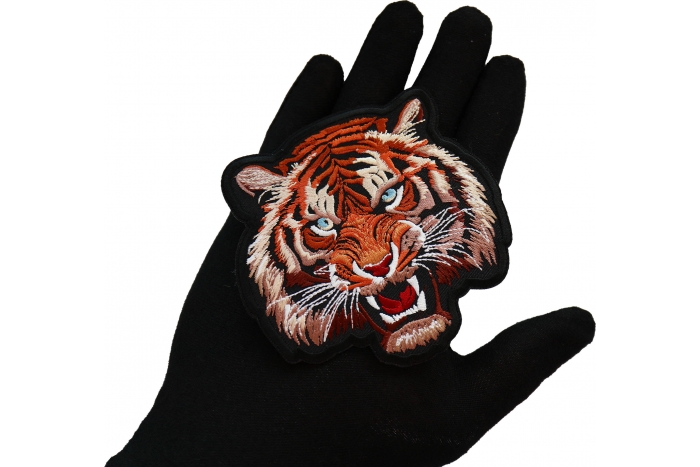 Handsome Tiger Patch shown on hand for size comparison