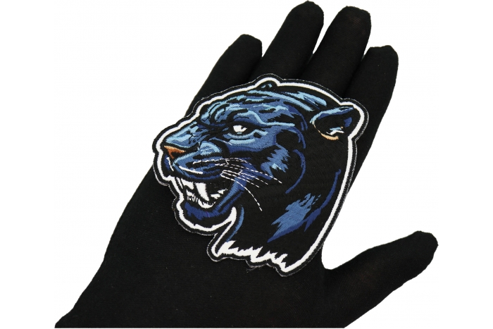 Jaguar Patch shown on hand for size comparison