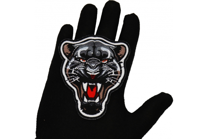 Jaguar Snarling Patch shown on hand for size comparison