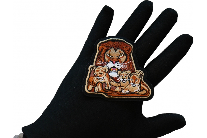 Lion and Babies Iron on Patch shown on hand for size comparison