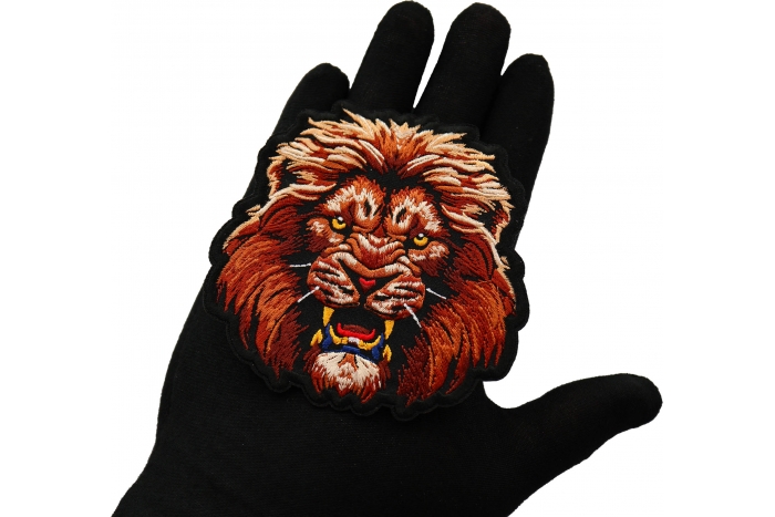 Lion Stare Patch shown on hand for size comparison