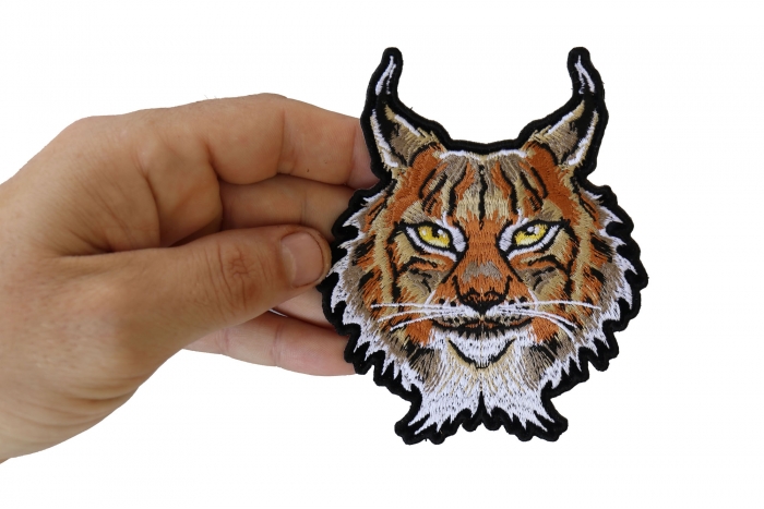 Lynx Cat Small Patch shown on hand for size comparison