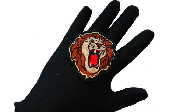 Male Lion Iron on Patch shown on hand for size comparison