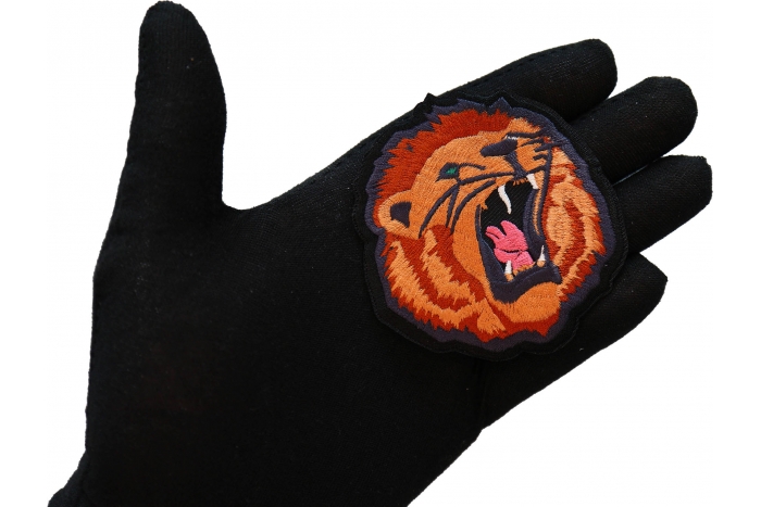 Roaring Lion Iron on Patch shown on hand for size comparison