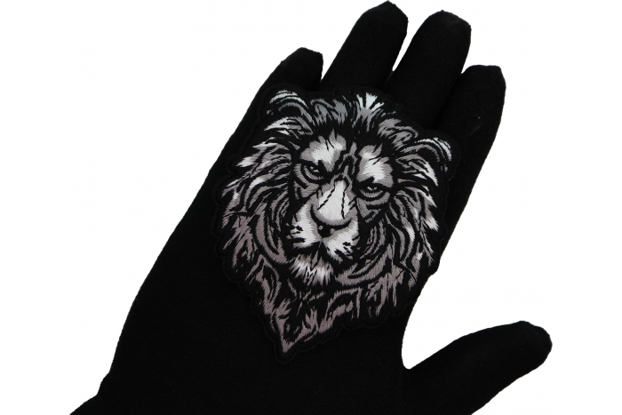 Silver Lion Patch shown on hand for size comparison