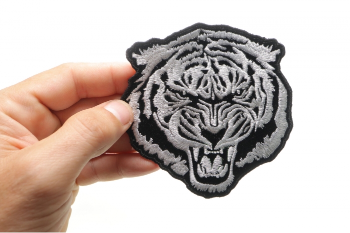 Small White Baron Tiger Iron on Patch shown on hand for size comparison