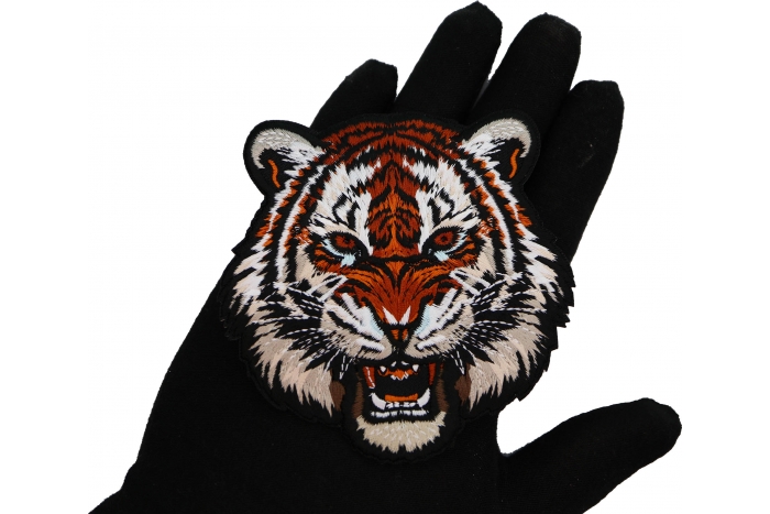 Tiger Patch shown on hand for size comparison