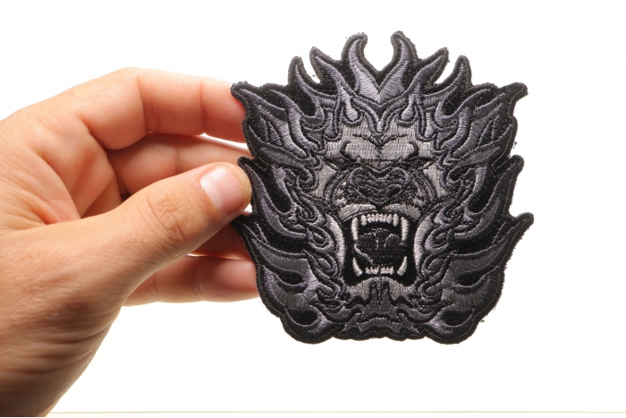 Lion Sew on Patch for Vests shown on hand for size comparison