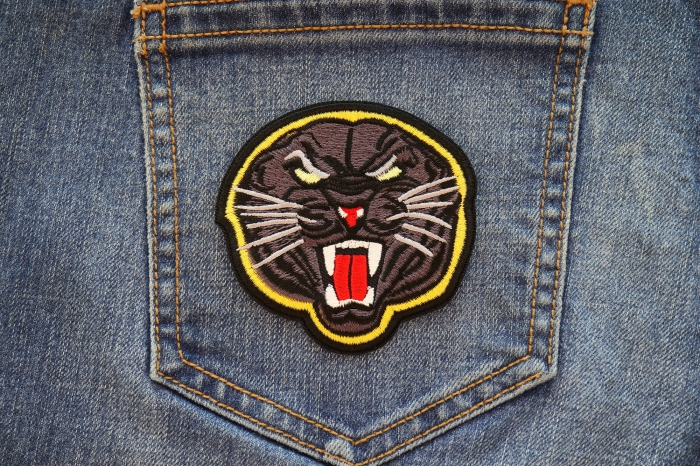 Black Jaguar Iron on Patch shown on jeans
