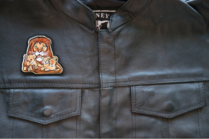 Lion and Babies Iron on Patch shown on leather vest