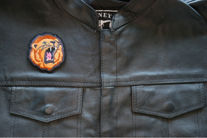 Roaring Lion Iron on Patch shown on leather vest