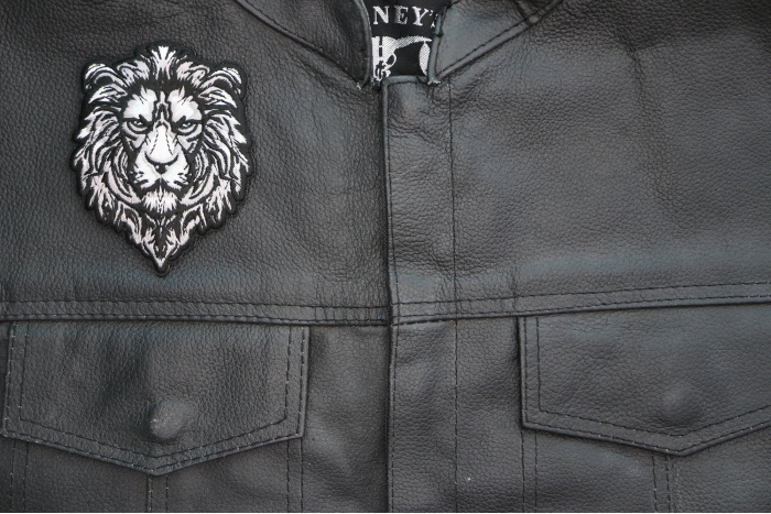 Silver Lion Patch shown on leather vest