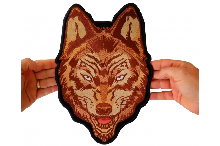 Wolf Patch, Large Animal Patches for Jackets shown on hand for size comparison