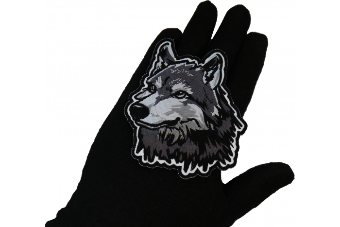 Gray Wolf Patch shown on hand for size comparison